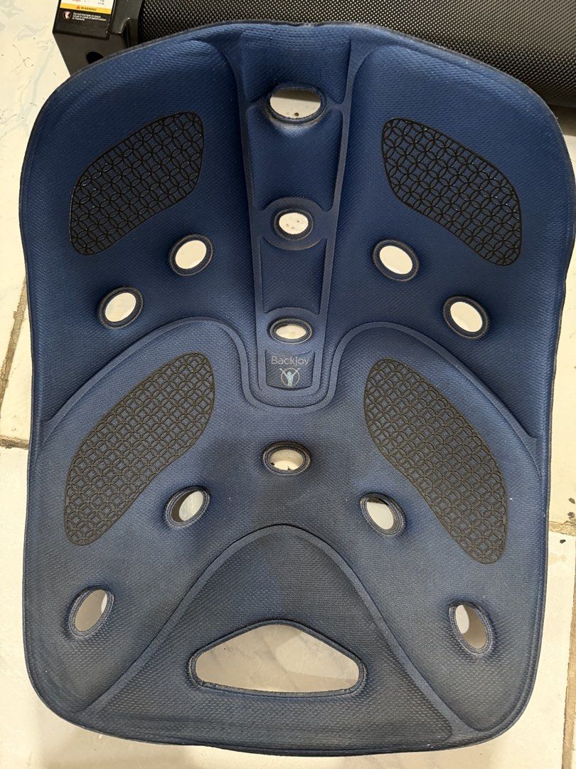 BackJoy Posture Sit Smart Orthotic Support Seat Blue Black (Category: Braces, Support & Protection) located in Mandaluyong City. Submitted by iamtinkerbell (Listing ID 1465401236, Image 1). Description: - Ergonomic blue seat cushion designed to support natural spinal alignment and cup the buttocks - Features multiple ventilation holes for airflow and comfort - Equipped with black anti-slip pads to keep the cushion securely in place - Durable soli
