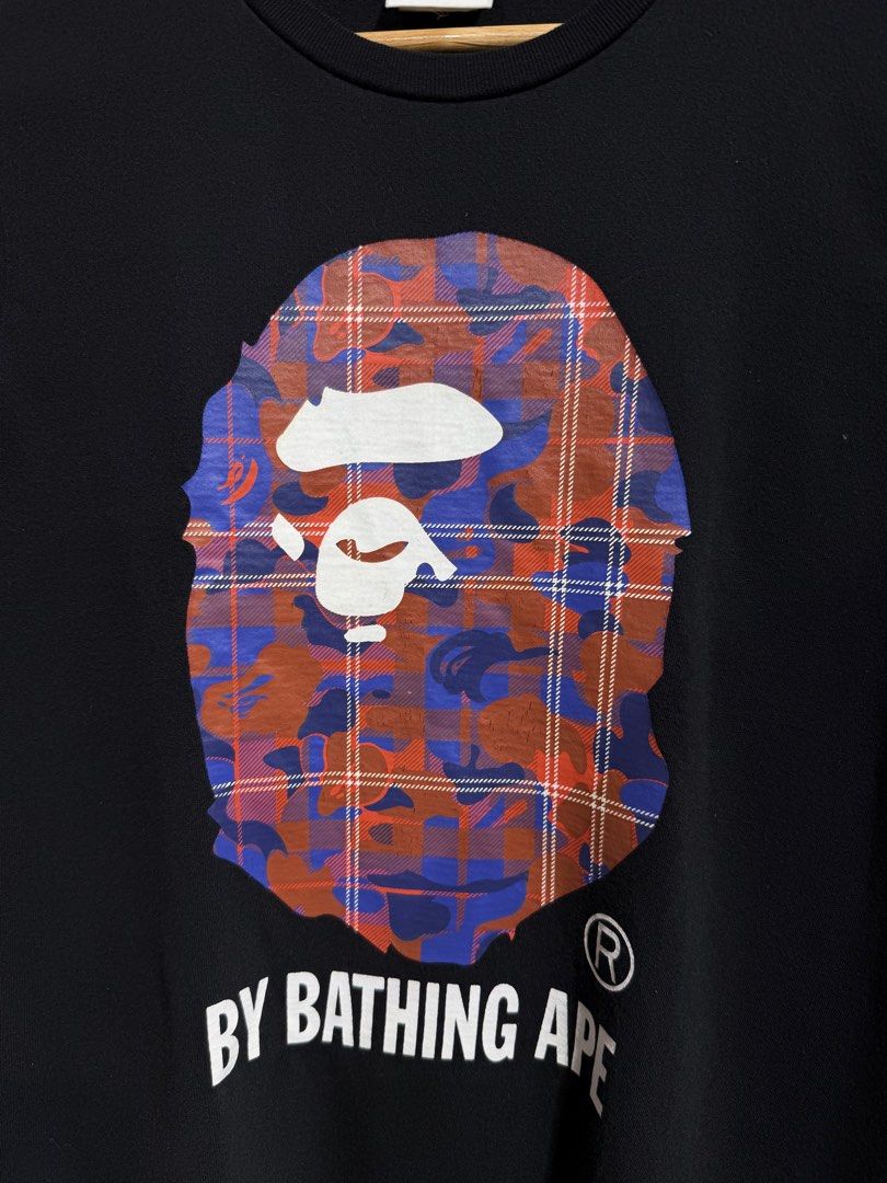 BAPE A Bathing Ape Plaid Camo Ape Head Tee (Category: Shirts) located in Manila. Submitted by ardobe.mnl (Listing ID 1465534743, Image 3). Description: Bape Plaid Bighead Logo Black Tee. Size: Large - Women’s (Women’s cut) Dimes: 20.5x27 Condition: Excellent Flaw: Minimal Hairline crack! Dm for inquiries! 📥.