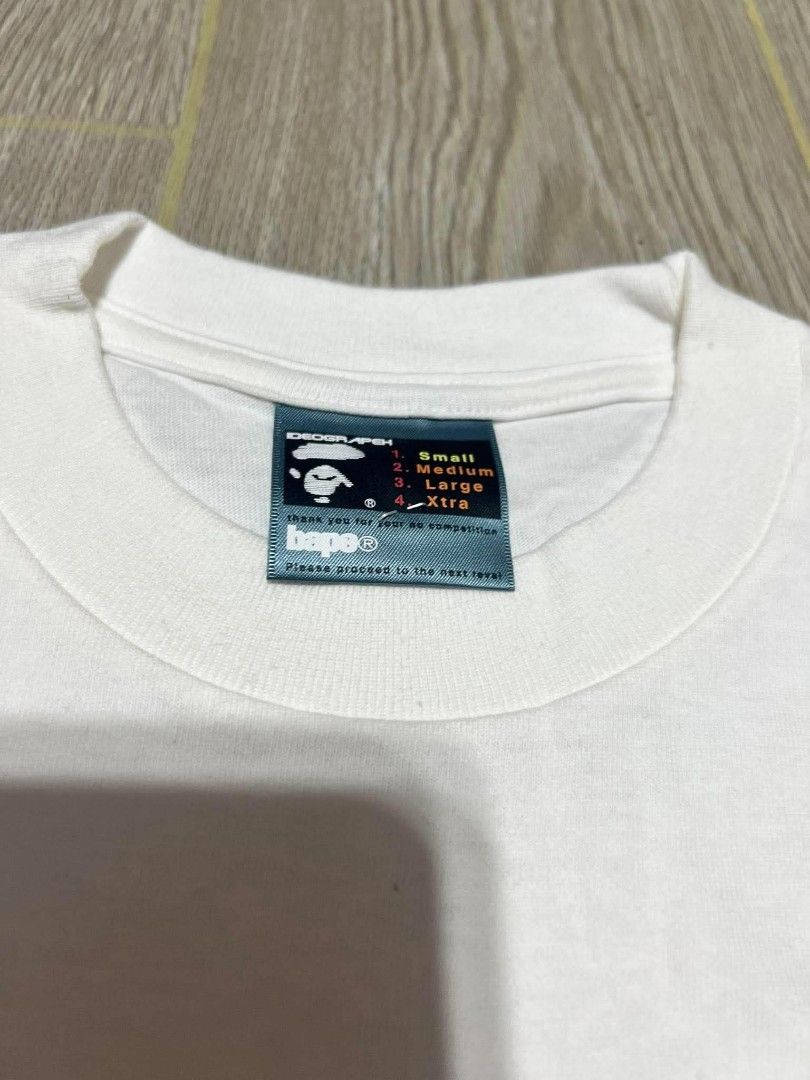 BAPE NIGO Ape Sounds Graphic Tee White (Category: Tshirts & Polo Shirts ) located in Puerto Princesa. Submitted by jaymark.1992 (Listing ID 1465490561, Image 3). Description: - Brand: BAPE (Ape Sounds Collection by NIGO) - Color: White with black and colorful stripe graphic Bape A Bathing Ape Limited Edition Collaboration x Futura Unkle Vintage T-shirt SMALL ON TAG W18"X L26 EXCELENT TO NEAR LIKE NEW CONDITION COLOR RATE:9.8/10 NEED WASH PALAWAN 