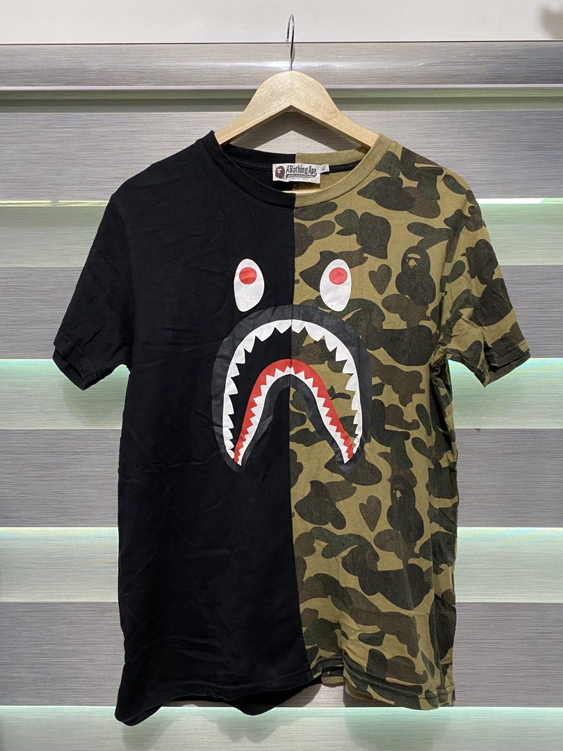 BAPE Shark Camo Split Tee Black Green Size XL (Category: Tshirts & Polo Shirts ) located in Butuan. Submitted by nielben13 (Listing ID 1465392112, Image 1). Description: - Brand: BAPE (A Bathing Ape) - Item: Split Shark Tee - Colorway: Black / Green Camo - Size: Med to Large - Details: Classic front shark graphic, vertical WGM lettering on the back, and Ape head sleeve tag - Issue Cut tags .