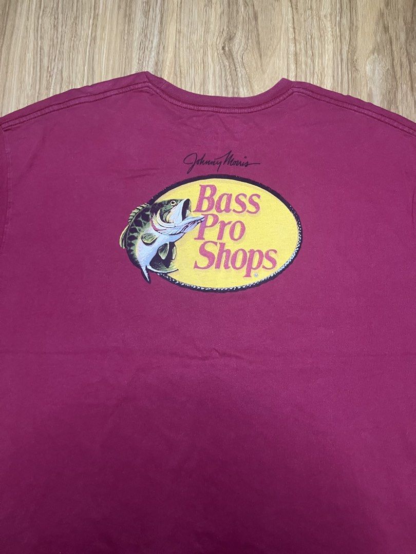 Bass Pro Shops Maroon 2XL 27X30 (Category: Tshirts & Polo Shirts ) located in Cebu City. Submitted by guttathreads (Listing ID 1465429787, Image 3). Description: - Brand: Bass Pro Shops - Color: Maroon - Size: 2XL (Regular Fit) -issue has stain below logo - Material: 100% Cotton, Made in Pakistan - Design: Johnny Morris signature logo on front chest, large logo on the back - Condition: Good, with a small ink/stain mark near the front logo.