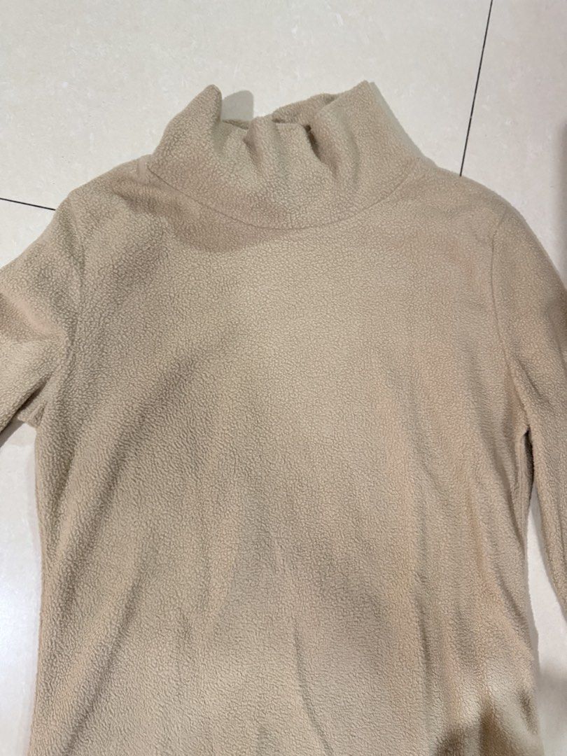 Beige cream high neck fleece sweater pullover (Category: Coats, Jackets and Outerwear) located in Quezon City. Submitted by sweetlyluxe (Listing ID 1465499188, Image 2). Description: - Color: Neutral beige - Material: Soft and fuzzy fleece - Neckline: High mock neck for extra warmth - Fit: Relaxed fit with long sleeves - Style: Great basic for layering with jeans or skirts for winter.