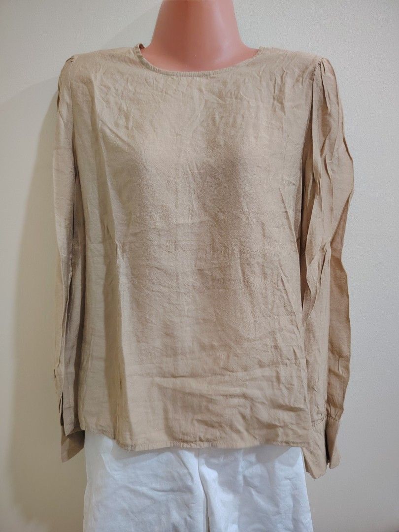 Beige Long Sleeve Button Cuff Blouse (Category: Longsleeves) located in Quezon City. Submitted by timelesstreasure117 (Listing ID 1465549809, Image 1). Description: Can fit from small to medium Good condition ₱70 Bundle with my other top listings to get discount 5 for ₱300 10 for ₱500 Buyer books courier of choice Payment via gcash or paymaya.