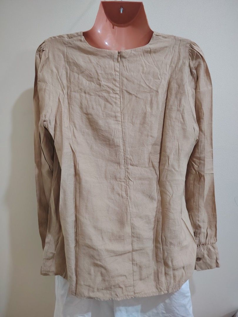 Beige Long Sleeve Button Cuff Blouse (Category: Longsleeves) located in Quezon City. Submitted by timelesstreasure117 (Listing ID 1465549809, Image 3). Description: Can fit from small to medium Good condition ₱70 Bundle with my other top listings to get discount 5 for ₱300 10 for ₱500 Buyer books courier of choice Payment via gcash or paymaya.