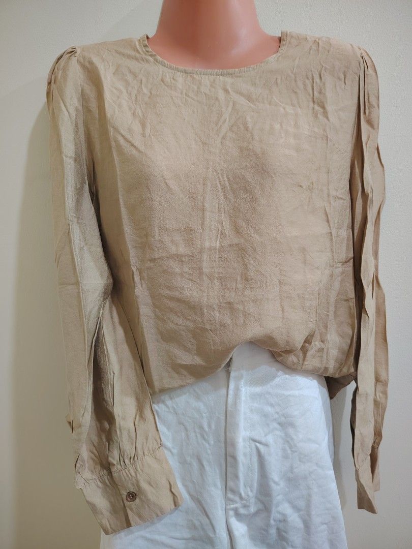 Beige Long Sleeve Button Cuff Blouse (Category: Longsleeves) located in Quezon City. Submitted by timelesstreasure117 (Listing ID 1465549809, Image 2). Description: Can fit from small to medium Good condition ₱70 Bundle with my other top listings to get discount 5 for ₱300 10 for ₱500 Buyer books courier of choice Payment via gcash or paymaya.
