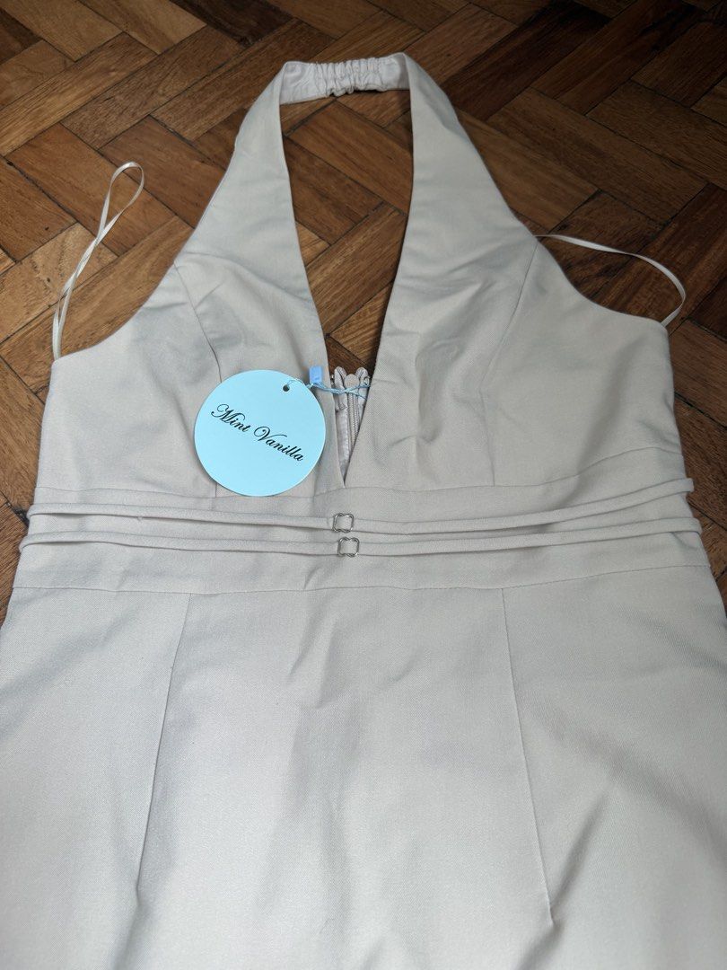 Beige mini halter dress (Category: Dresses) located in Makati City. Submitted by demrixxx27 (Listing ID 1465387156, Image 3). Description: Can fit to small and medium .