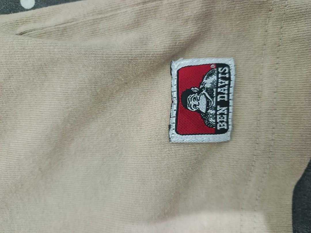 Ben Davis Tan Logo T-Shirt Size L (Category: Tshirts & Polo Shirts ) located in Caloocan City. Submitted by iandoom09 (Listing ID 1465498713, Image 3). Description: - Brand: Ben Davis - Color: Tan - Size: Large (100% Cotton) - Design: Small chest logo & large back print - Details: Classic crew neck, short sleeves, and iconic woven monkey patch near hem - Condition: Excellent / Pre-loved (manage expectations).