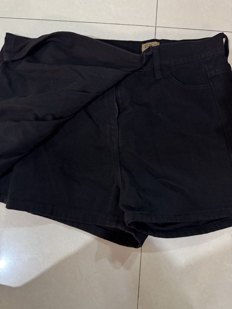 Bench Black Denim Skort Size M (Category: Skirts) located in Quezon City. Submitted by sweetlyluxe (Listing ID 1465486807, Image 3). Description: - Brand: Bench - Size: Medium - Color/Wash: Clean black denim - Style: Skort (wrap front skirt look with built-in shorts) - Closure: Silver front button with zipper - Pockets: Two functional back pockets - Condition: Excellent.