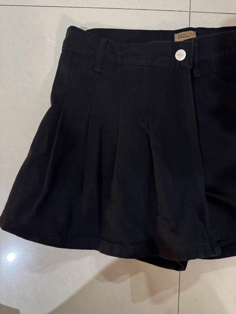 Bench Black Denim Skort Size M (Category: Skirts) located in Quezon City. Submitted by sweetlyluxe (Listing ID 1465486807, Image 2). Description: - Brand: Bench - Size: Medium - Color/Wash: Clean black denim - Style: Skort (wrap front skirt look with built-in shorts) - Closure: Silver front button with zipper - Pockets: Two functional back pockets - Condition: Excellent.