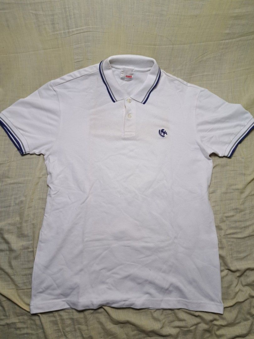Bench White Polo Shirt Size L (Category: Tshirts & Polo Shirts ) located in Manila. Submitted by sainty.exe (Listing ID 1465455169, Image 1). Description: - Brand: Bench - Color: White with blue and grey ribbed collar and cuffs - Size: Large - Details: Two-button placket closure, small embroidered chest logo - Style: Classic casual, easy to match with jeans or shorts - Condition: Excellent.