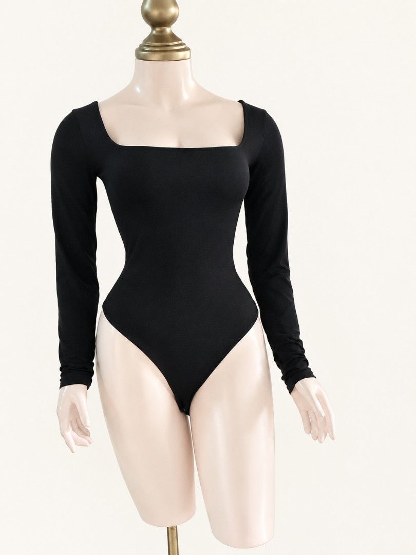 Bershka black longsleeves bodysuit 30-38bust (Category: Longsleeves) located in Angeles City. Submitted by milovewardrobe (Listing ID 1463824568, Image 2). Description: 30-38 bust Like new fabric May tape mark lang po sa dulo ng shoulder sleeves pang stopper (see last pic).