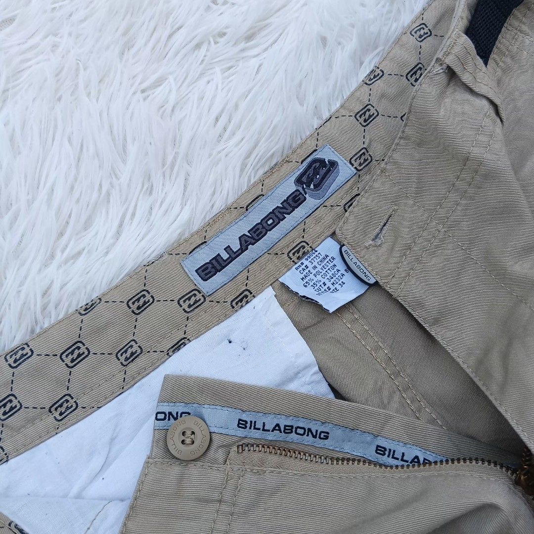 Billabong Beige Cargo Shorts Size 34 (Category: Shorts) located in Gattaran. Submitted by thrift_wiseph (Listing ID 1465484499, Image 2). Description: Billabong khaki beige cargo shorts, size 34. Made from 65% polyester and 35% cotton blend. Built-in black adjustable belt with buckle closure. Multiple pockets including zippered side pockets and branded logo tags. Classic skate surf style..