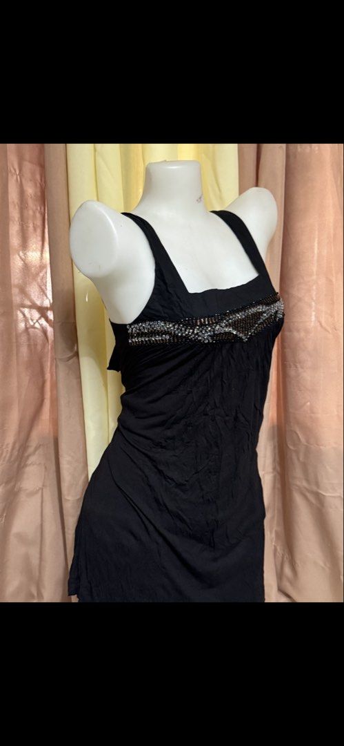 Black Beaded Square Neck Dress with Back Tie (Category: Dresses) located in Marikina City. Submitted by lorradel (Listing ID 1465393774, Image 2). Description: - Color: Black - Length: Midi - small on tag but fits medium - Fit: Loose fit with soft gathered fabric in front - Neckline & Straps: Square neckline with thick straps - Details: Detailed silver and bronze beading along the chest - Back: Cute tie-up ribbon closure - Condition: Worn a few t