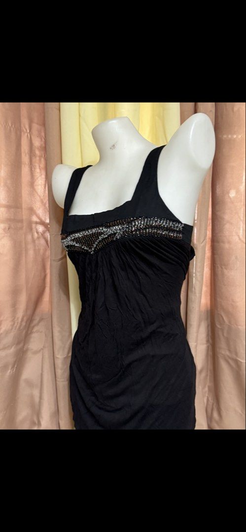 Black Beaded Square Neck Dress with Back Tie (Category: Dresses) located in Marikina City. Submitted by lorradel (Listing ID 1465393774, Image 3). Description: - Color: Black - Length: Midi - small on tag but fits medium - Fit: Loose fit with soft gathered fabric in front - Neckline & Straps: Square neckline with thick straps - Details: Detailed silver and bronze beading along the chest - Back: Cute tie-up ribbon closure - Condition: Worn a few t