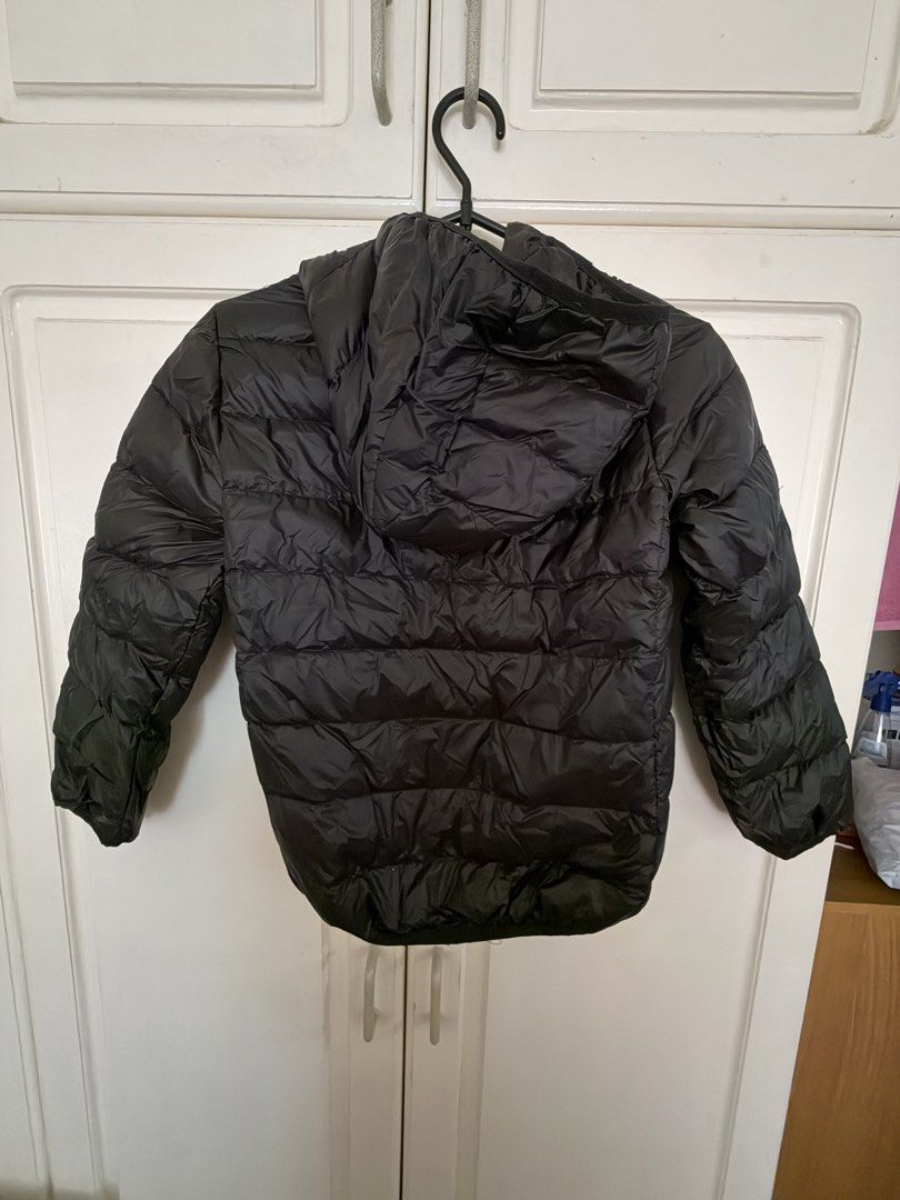 Black hooded puffer jacket quilted winter coat (Category: Babies & Kids Fashion) located in Paranaque City. Submitted by mayan_q (Listing ID 1465450838, Image 2). Description: Worn only once during our Japan trip - Classic Black - Quilted design traps heat effectively - Two deep interior drop pockets for essentials - Lightweight material that easily folds and packs into a bag - Comfort Features: Built-in hood, full front zipper, and smooth inner 