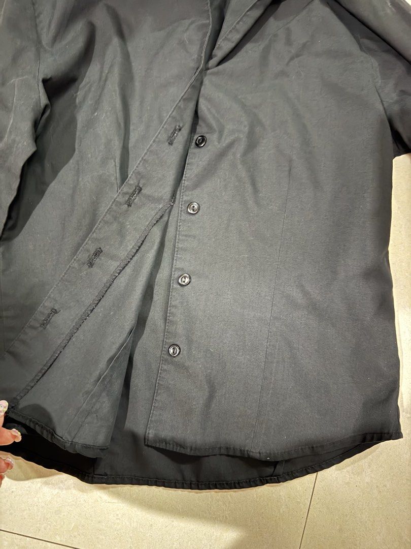 Black Long-Sleeve Button-Up Shirt (Category: Longsleeves) located in Quezon City. Submitted by sweetlyluxe (Listing ID 1465489015, Image 2). Description: - Color: Solid black - Style: Long-sleeve button-down with classic collar and dark front buttons - Fit: Standard fit with a curved hemline - Fabric: Lightweight and versatile - Condition: Clean, excellent overall condition - Occasion: Perfect for both casual and formal wear, office corporate wea