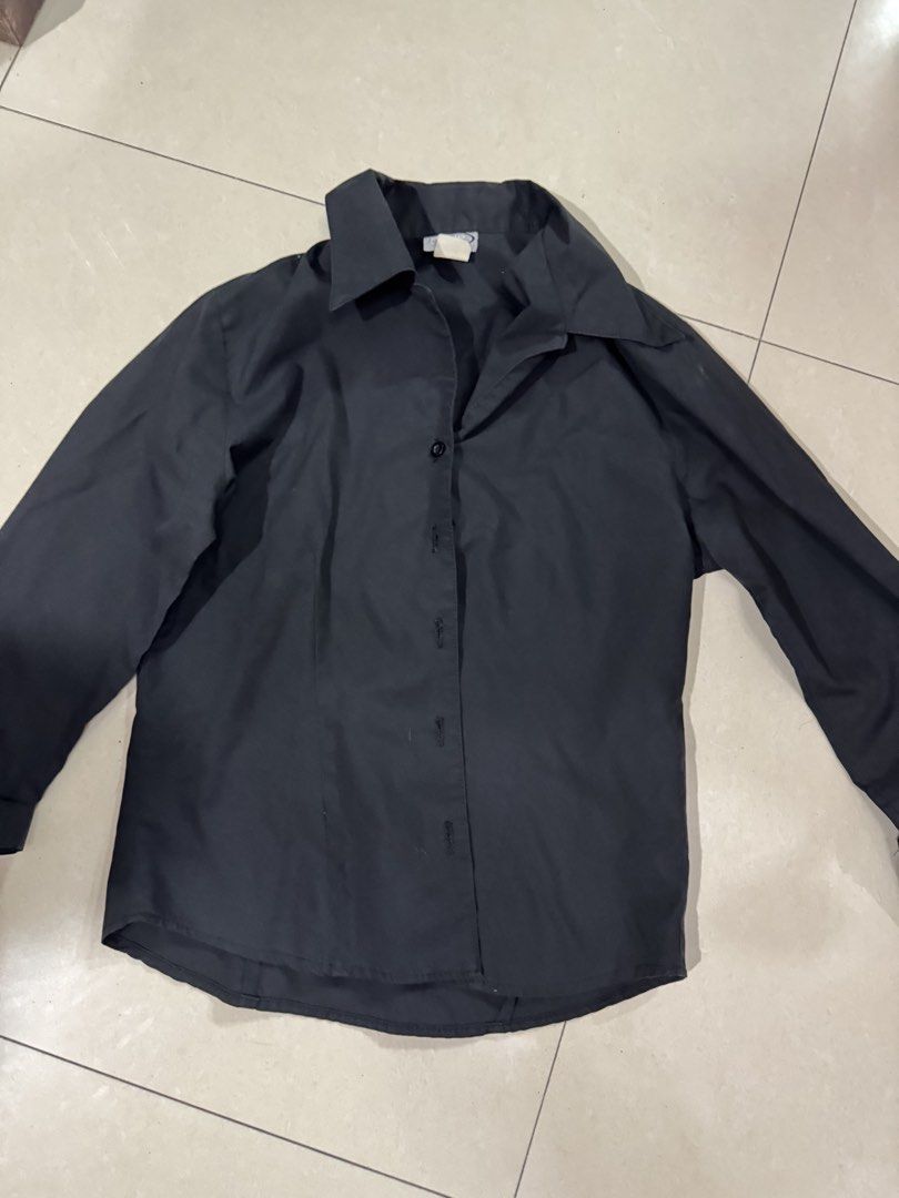 Black Long-Sleeve Button-Up Shirt (Category: Longsleeves) located in Quezon City. Submitted by sweetlyluxe (Listing ID 1465489015, Image 1). Description: - Color: Solid black - Style: Long-sleeve button-down with classic collar and dark front buttons - Fit: Standard fit with a curved hemline - Fabric: Lightweight and versatile - Condition: Clean, excellent overall condition - Occasion: Perfect for both casual and formal wear, office corporate wea