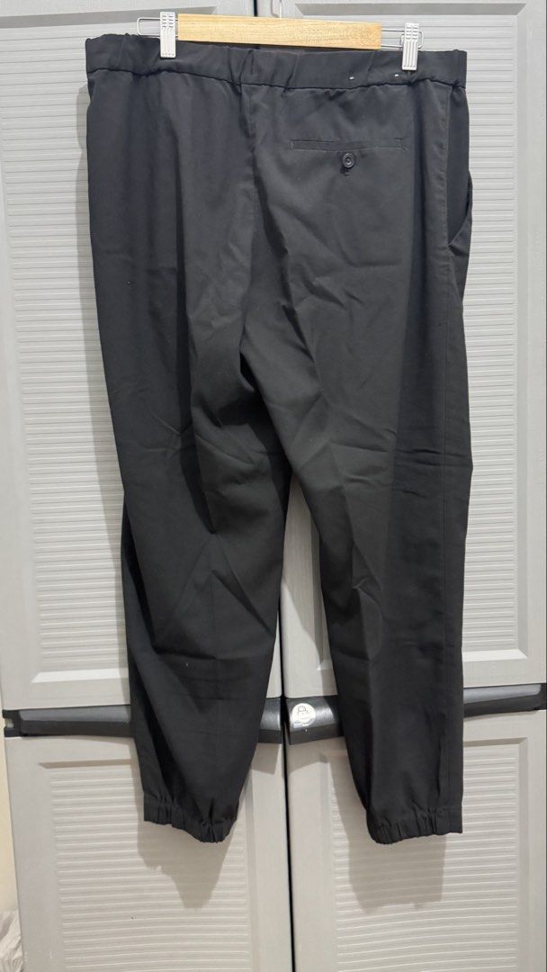 Black Pleated Casual Trousers Pants (Category: Trousers) located in Quezon City. Submitted by heyhaveaniceday (Listing ID 1465508373, Image 2). Description: - Color: Black - Fit: Loose fit with pleated front - Waist: Button closure, zipper fly, and back elasticated waistband - Pockets: Single-button back pocket - Fabric: Clean texture, comfortable for daily wear - Versatility: Easy to match with tees and shirts.