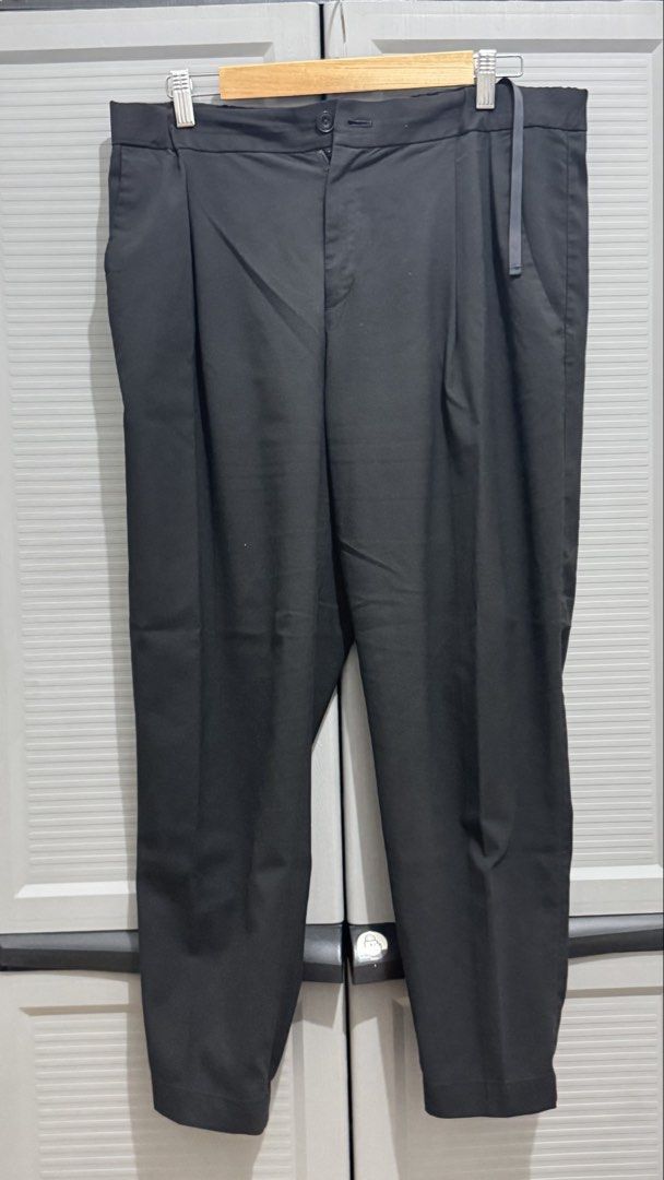Black Pleated Casual Trousers Pants (Category: Trousers) located in Quezon City. Submitted by heyhaveaniceday (Listing ID 1465508373, Image 1). Description: - Color: Black - Fit: Loose fit with pleated front - Waist: Button closure, zipper fly, and back elasticated waistband - Pockets: Single-button back pocket - Fabric: Clean texture, comfortable for daily wear - Versatility: Easy to match with tees and shirts.