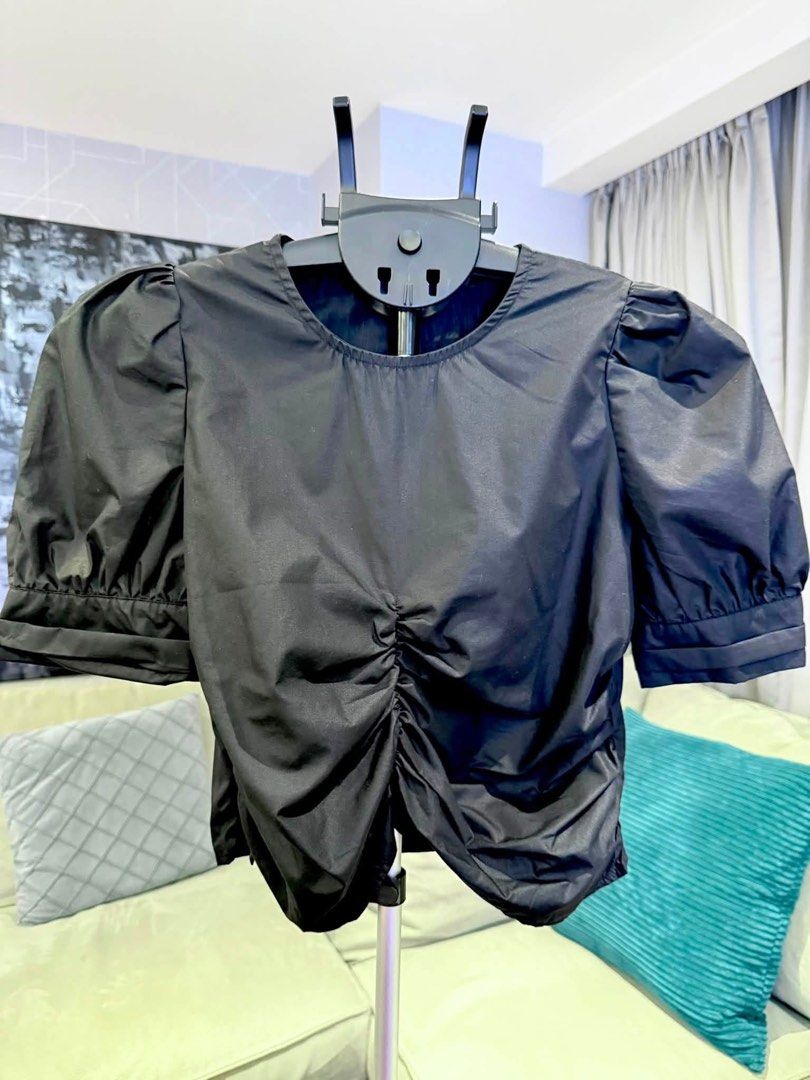 Black puff short sleeves blouse (Category: Blouses) located in Taguig. Submitted by annebydesign (Listing ID 1465543214, Image 2). Description: Hi all. Selling this Black short puff sleeve blouse with front & side pleated for ₱300 •Like new. Bought at a garage sale •Fits small. Back button. May button din sa arm hem •Versatile- pwede sa denim pwede sa trouser pants Loc: Taguig BGC Mop: GCash/ Bank transfer/ COD Mod: Courier or Rider pick up.