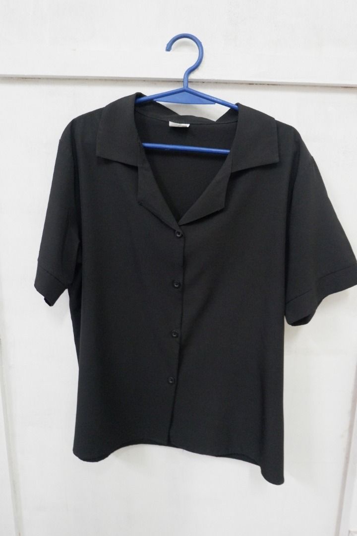 Black Short Sleeve Button Down Blouse Collar Shirt (Category: Blouses) located in Quezon City. Submitted by theusualneed (Listing ID 1465443674, Image 3). Description: - Color: Solid black - Style: Short sleeve button-down with classic camp collar - Fabric: Smooth, lightweight, and very breathable - Details: Four matching front buttons, clean hem and cuffs - Versatility: Easy to pair with any bottoms for casual or work wear.