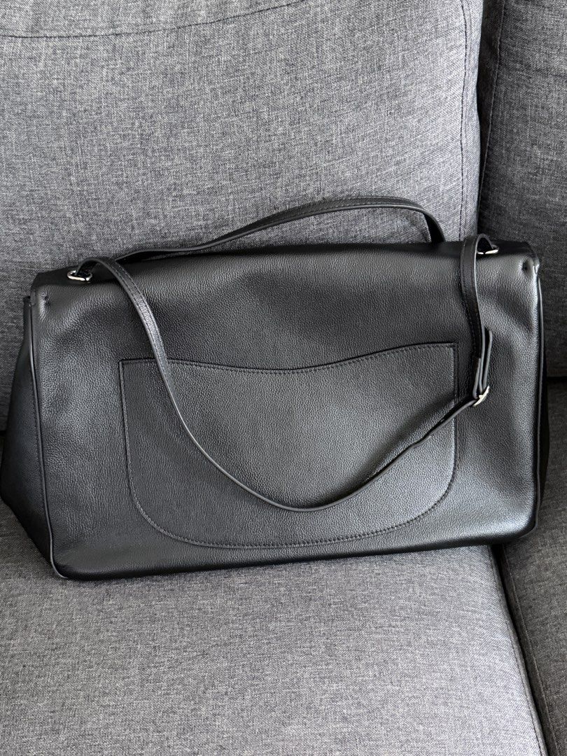 Black Shoulder Crossbody Bag (Category: Shoulder Bags) located in Quezon City. Submitted by MissusB (Listing ID 1465427043, Image 3). Description: Leather. Soft Flap bag NO BRAND Alam nyo na anong look peg nito LARGE, 40cm length. Kasya 13in mac air sa slot sa likod ng inside flap. May dedicated sya - Style: Black textured leather shoulder bag with a structured flap - Hardware: Silver-tone twist lock and metal strap rings - Strap: Long and adjust
