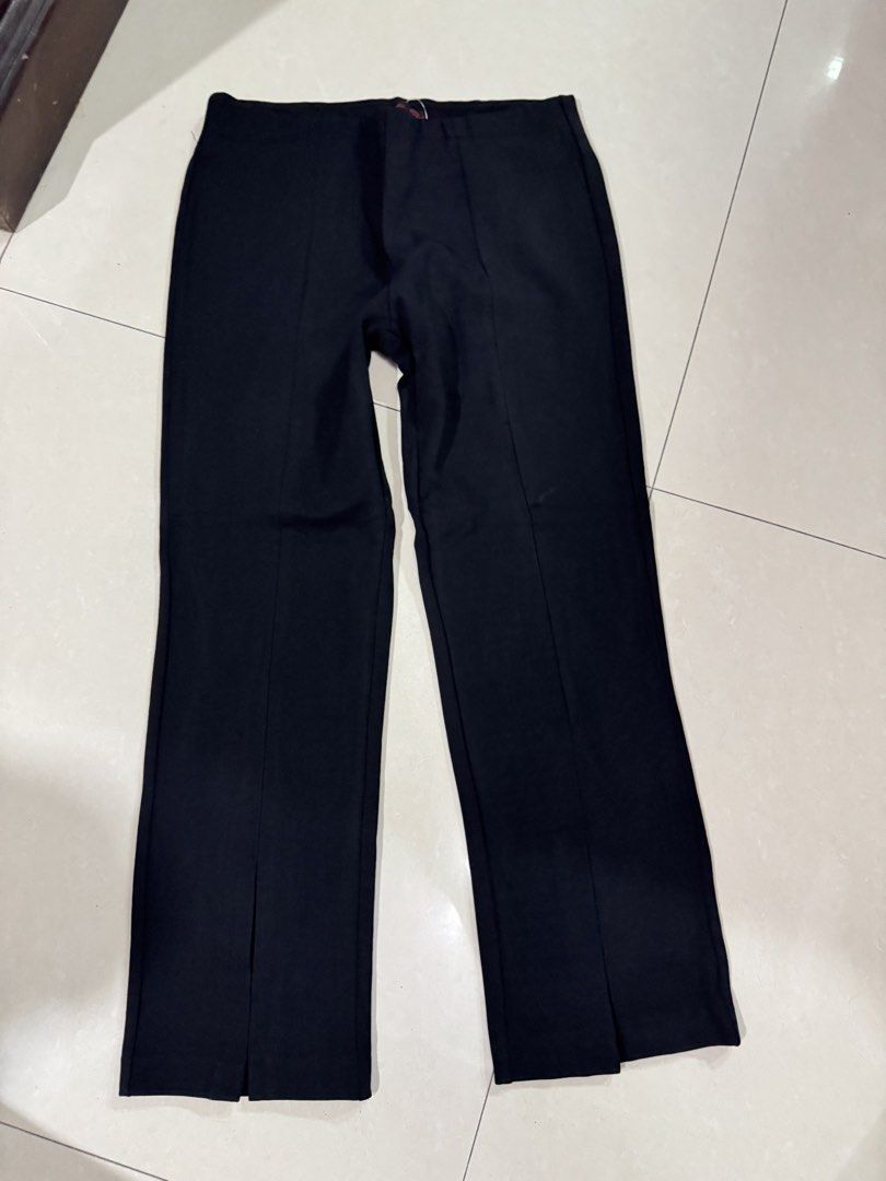 Black Split Hem Trousers Pants (Category: Jeans) located in Quezon City. Submitted by sweetlyluxe (Listing ID 1465490239, Image 1). Description: - Color: Solid black - Design: Front split hems at the ankles with structured center creases - Waist: Simple pull-on style for easy wear - Versatility: Perfect for office wear, casual days, or everyday outfits, corporate - Fit: Great fit and very easy to match with various tops and shoes.
