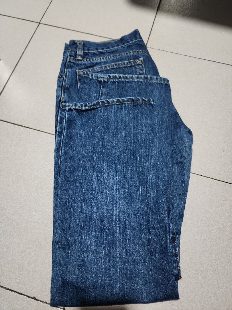 Blue Denim Jeans (Category: Jeans) located in Manila. Submitted by chichayako (Listing ID 1465445314, Image 1). Description: - Color: Medium wash blue - Fit: Straight leg cut - Design: Classic five-pocket style with contrast stitching - Details: Belt loops, standard button and zipper fly closure - Material: Smooth denim texture (no excessive fading or distressing) - Condition: Excellent / Ready to wear.