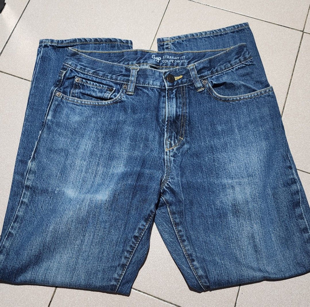 Blue Denim Jeans (Category: Jeans) located in Manila. Submitted by chichayako (Listing ID 1465445314, Image 3). Description: - Color: Medium wash blue - Fit: Straight leg cut - Design: Classic five-pocket style with contrast stitching - Details: Belt loops, standard button and zipper fly closure - Material: Smooth denim texture (no excessive fading or distressing) - Condition: Excellent / Ready to wear.