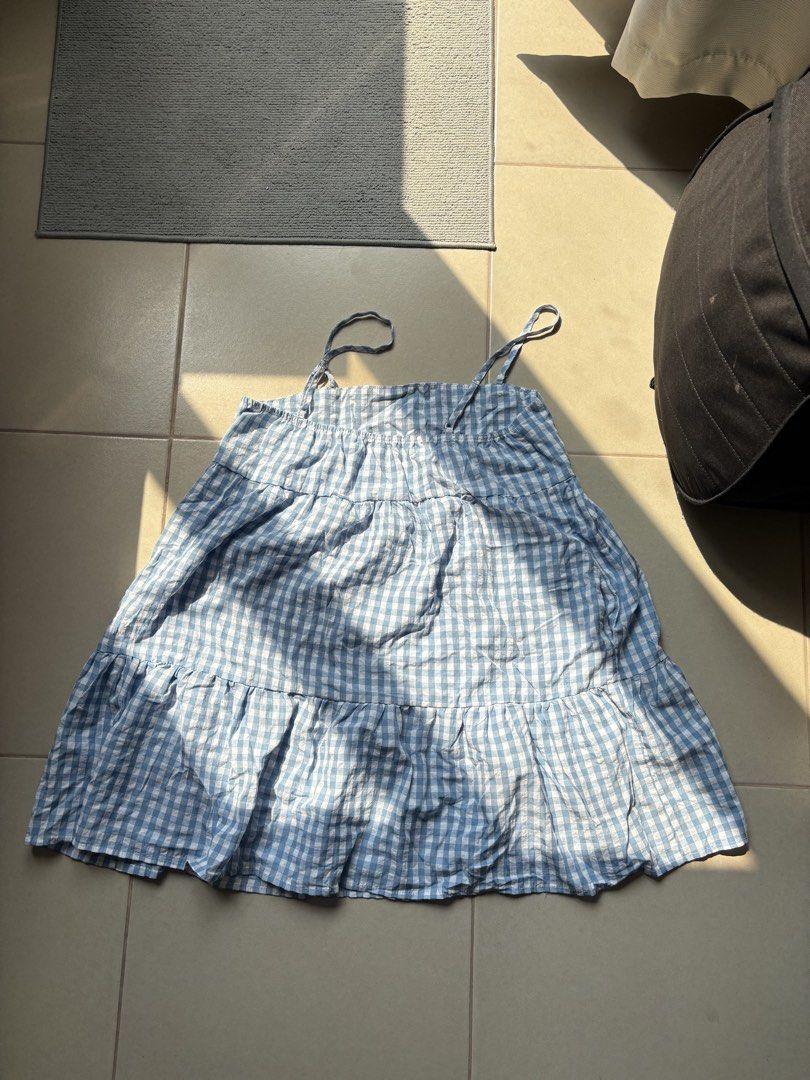 Blue Gingham Spaghetti Strap Tiered Dress Size M (Category: Dresses) located in Quezon City. Submitted by therealpaulsebastian.910 (Listing ID 1465392222, Image 1). Description: - Style: Blue and white checkered dress with a chic tiered design - Size: Medium - Straps: Delicate spaghetti straps - Material: 60% polyester, 40% cotton (lightweight with a great drape) - Condition: Great, easy to throw on for casual days.
