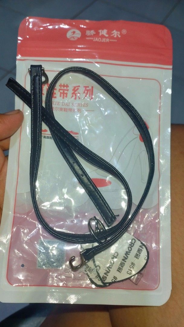 Bluetooth Earphone and Shoe strap set (Category: Earphones) located in Valenzuela. Submitted by diane.35 (Listing ID 1465486188, Image 2). Description: - Color: Black mini single wireless earphone - Includes: USB charging cable with pin connector and a white pouch with green/red accents - Bonus item: Black adjustable shoe strap with durable metal hooks - Condition: Brand new and ready to use - Perfect bundle of useful small items at a great price