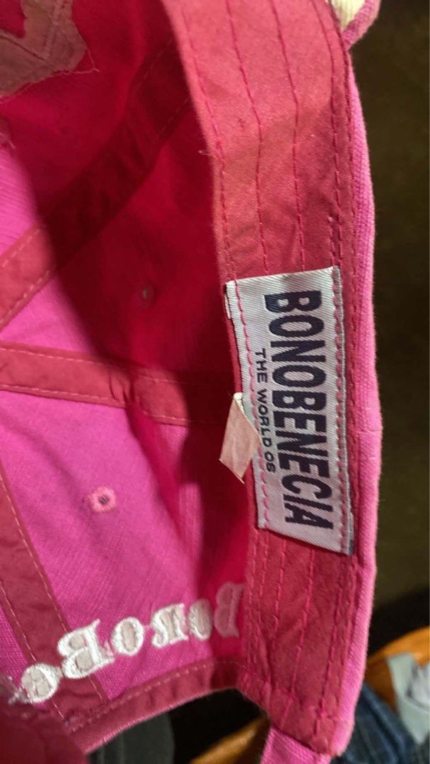 Y2K pink Bonobenecia Pink Distressed Baseball Cap Hat (Category: Hats & Beanies) located in Cagayan de Oro. Submitted by mighty.yangie (Listing ID 1465486381, Image 2). Description: - Brand: Bonobenecia - Color: Bright pink - Design: Distressed edges with heavy front embroidery - Fit: Adjustable strap closure at the back - Details: Official brand label stitched on the inner band.