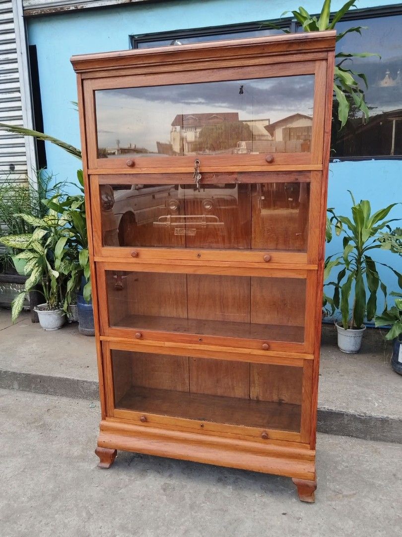 Bookcase (Category: Shelves, Cabinets & Racks) located in Meycauayan. Submitted by marygracecasimiro (Listing ID 1465427272, Image 3). Description: Vintage Barrister Bookcase made of solid Narra Wood with working original keys. Restored and revarnished. Ready to use. Get it for only P21,450 H66 x L36 x W12 inches♥️.