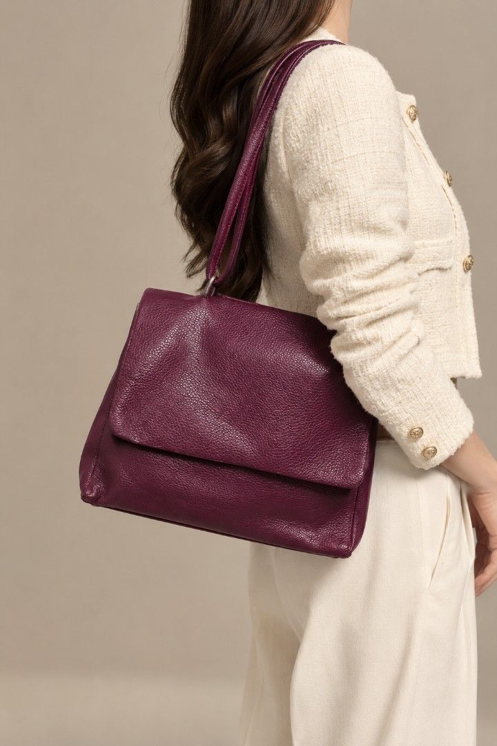 Borse in Pelle Pebbled Leather Shoulder Bag (Category: Tote Bags) located in Baguio. Submitted by PreiLoveMaria (Listing ID 1465515088, Image 1). Description: Borse in Pelle Pebbled Leather Shoulder Bag Classic Italian Craftmanship ​Add a rich pop of color to your wardrobe with this stunning burgundy leather shoulder bag. Crafted in Italy from premium pebbled leather with a structured flap-top design and classic hardware, it combines timeless ele