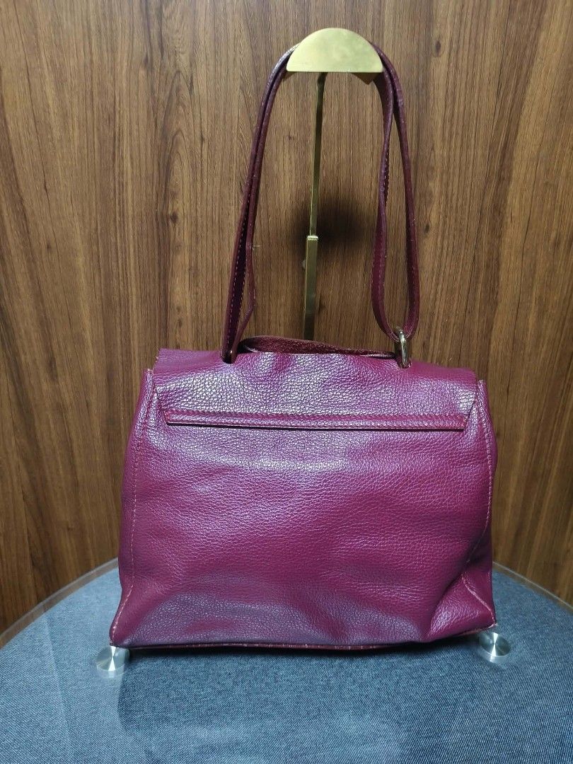 Borse in Pelle Pebbled Leather Shoulder Bag (Category: Tote Bags) located in Baguio. Submitted by luxuryvaultbagsandfashion (Listing ID 1465530349, Image 3). Description: Borse in Pelle Pebbled Leather Shoulder Bag Classic Italian Craftmanship Add a rich pop of color to your wardrobe with this stunning burgundy leather shoulder bag. Crafted in Italy from premium pebbled leather with a structured flap-top design and classic hardware, it combines t