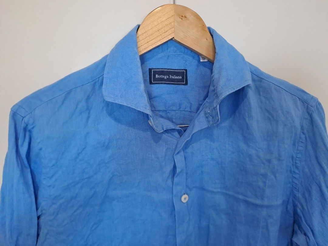 Bottega italia 100% linen (Category: Longsleeves) located in Manila. Submitted by joanbalde39643 (Listing ID 1465438673, Image 2). Description: This vibrant cornflower blue linen longsleeves features an elegant, wide French spread collar and a lightweight woven texture perfect for warm-weather styling. The inner collar is stitched with a premium fabric brand label reading "Bottega Italiana.".
