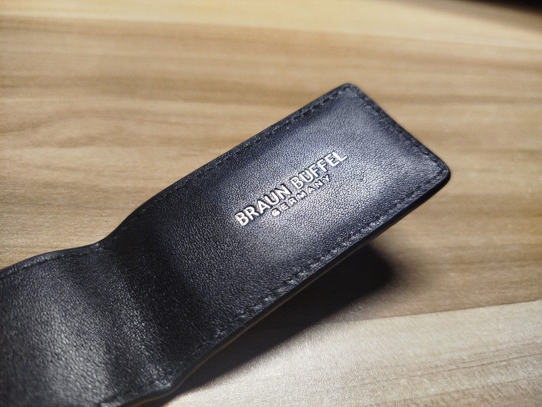 Braun Buffel Leather Money Clip (Category: Wallets & Card Holders) located in Valenzuela. Submitted by joshthian (Listing ID 1465390414, Image 3). Description: May dalawang indentation lines dahil nadaganan ng ibang items dahil na stuck lang siya sa drawer. Bought in Singapore back in 2019 never used since that year. (Photo attached at the end) 1500 fixed. Payment via GCash and shipping via Lalamove or J&T shouldered by the buyer..