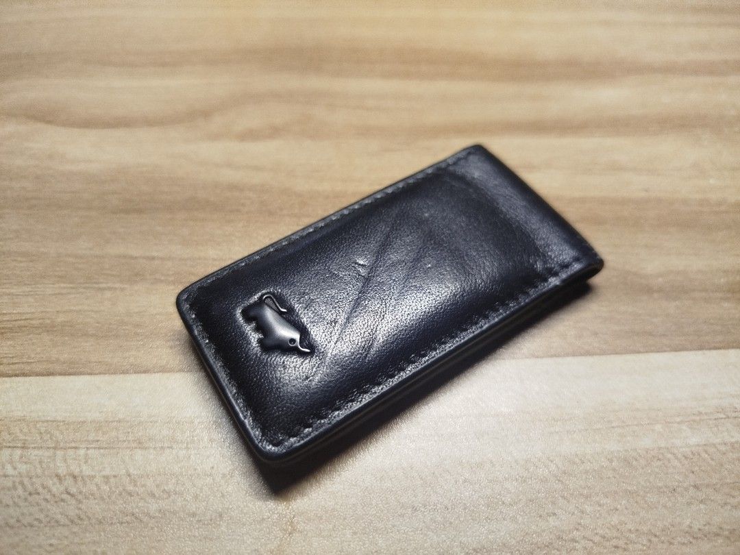 Braun Buffel Leather Money Clip (Category: Wallets & Card Holders) located in Valenzuela. Submitted by joshthian (Listing ID 1465390414, Image 1). Description: May dalawang indentation lines dahil nadaganan ng ibang items dahil na stuck lang siya sa drawer. Bought in Singapore back in 2019 never used since that year. (Photo attached at the end) 1500 fixed. Payment via GCash and shipping via Lalamove or J&T shouldered by the buyer..