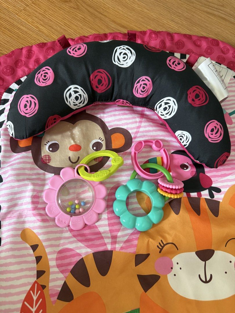 Bright Starts Wild & Whimsy™ Prop Mat (Category: Infant Playtime) located in Manila. Submitted by vydeleon (Listing ID 1465402596, Image 2). Description: - Brand: Bright Starts - Color/Theme: Pink with cute tiger and monkey design - Includes black and white patterned tummy time support pillow - Comes with matching colorful hanging teethers and bead rattle toys - Soft and comfortable fabric surface for infants - Perfect for daily tummy time and se