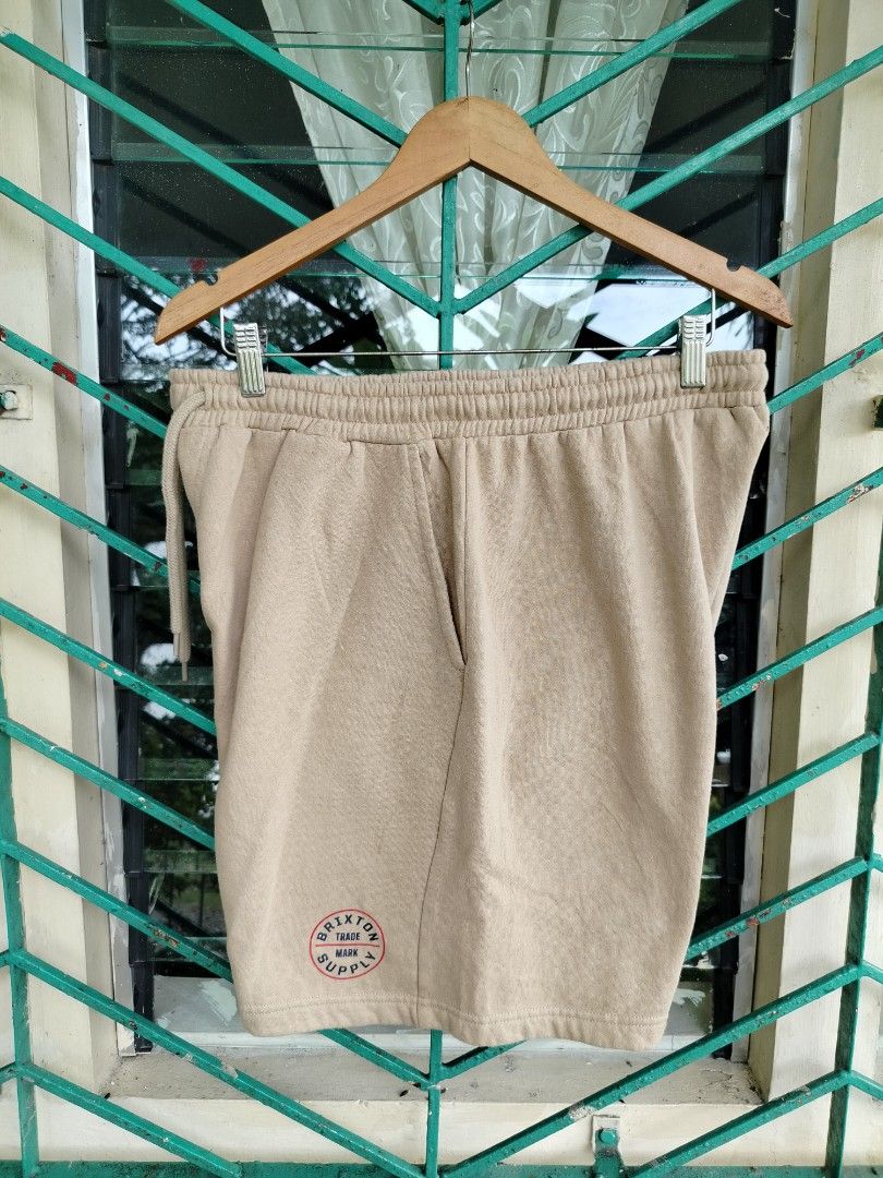 Brixton Sweatshorts Sand Size L (Category: Shorts) located in Manila. Submitted by gerald_quinto (Listing ID 1465470757, Image 1). Description: - Brand: Brixton - Item: Fleece sweatshorts - Color: Sand - Size: Large - Material: 60% cotton, 40% polyester with soft interior fabric - Features: Adjustable drawstring waist, functional side pockets, and small circular Brixton trademark supply graphic near the hem - Condition: Brand new / Excellent qual