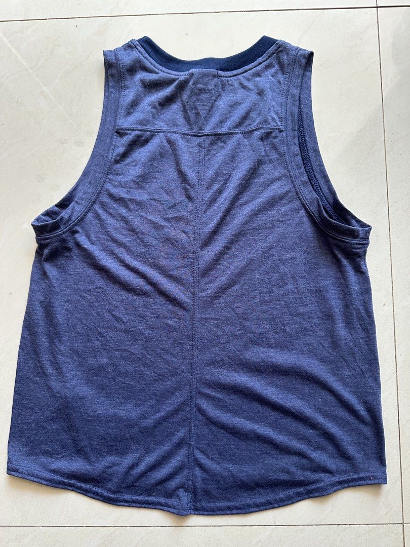 Brooks Running Top Size S (Category: Activewear) located in Rosales. Submitted by dariang22 (Listing ID 1465395131, Image 3). Description: - Brand: Brooks - Color: Heather blue - Size: S - Design: 'HAVE A BROOKS DAY!!!' graphic with Run Happy slogan and logo - Material: Lightweight, breathable athletic fabric - Fit: Relaxed fit with a comfortable racerback style - Condition: Excellent/Great for workouts and running.