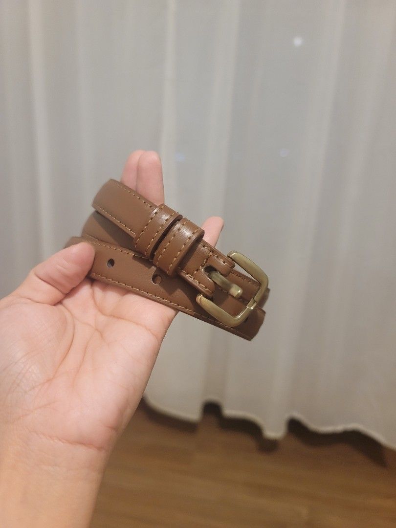 Brown Leather Belt with Gold Buckle (Category: Belts) located in Manila. Submitted by kamilleale02863 (Listing ID 1465495656, Image 1). Description: - Material: Brown faux leather with clean edge stitching - Hardware: Elegant gold-toned metal buckle and matching double loops - Fit: Standard width, ideal for trousers, skirts, and dresses - Style: Simple, versatile, and easy to pair with daily outfits - Condition: Excellent / Ready to ship.