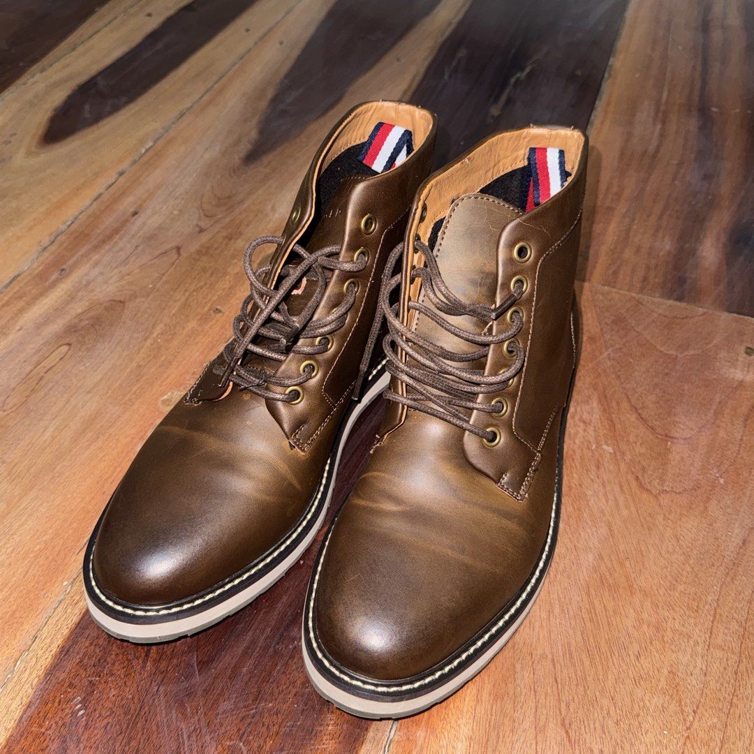 Brown Leather Boots (Category: Boots) located in Quezon City. Submitted by yannahmaldia (Listing ID 1465453449, Image 1). Description: - Brand: Tommy Hilfiger - Color: Dark Brown - Size: US 9 - Material: Genuine Leather - flaking and cracking on the inner lining - Inclusions: Original box included - barely used but shoes are in storage thats why the leather is cracking.