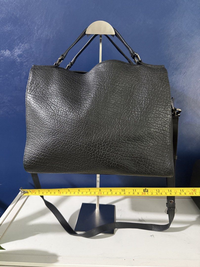 Bruno Magli black crossbody bag (Category: Cross-body Bags) located in Makati City. Submitted by katdestash (Listing ID 1465440210, Image 2). Description: Good as new Bruno Magli black crossbody bag with top handles. Gun metal hardware with Bruno Magli engraving with no visible scratches. Made in Italy.