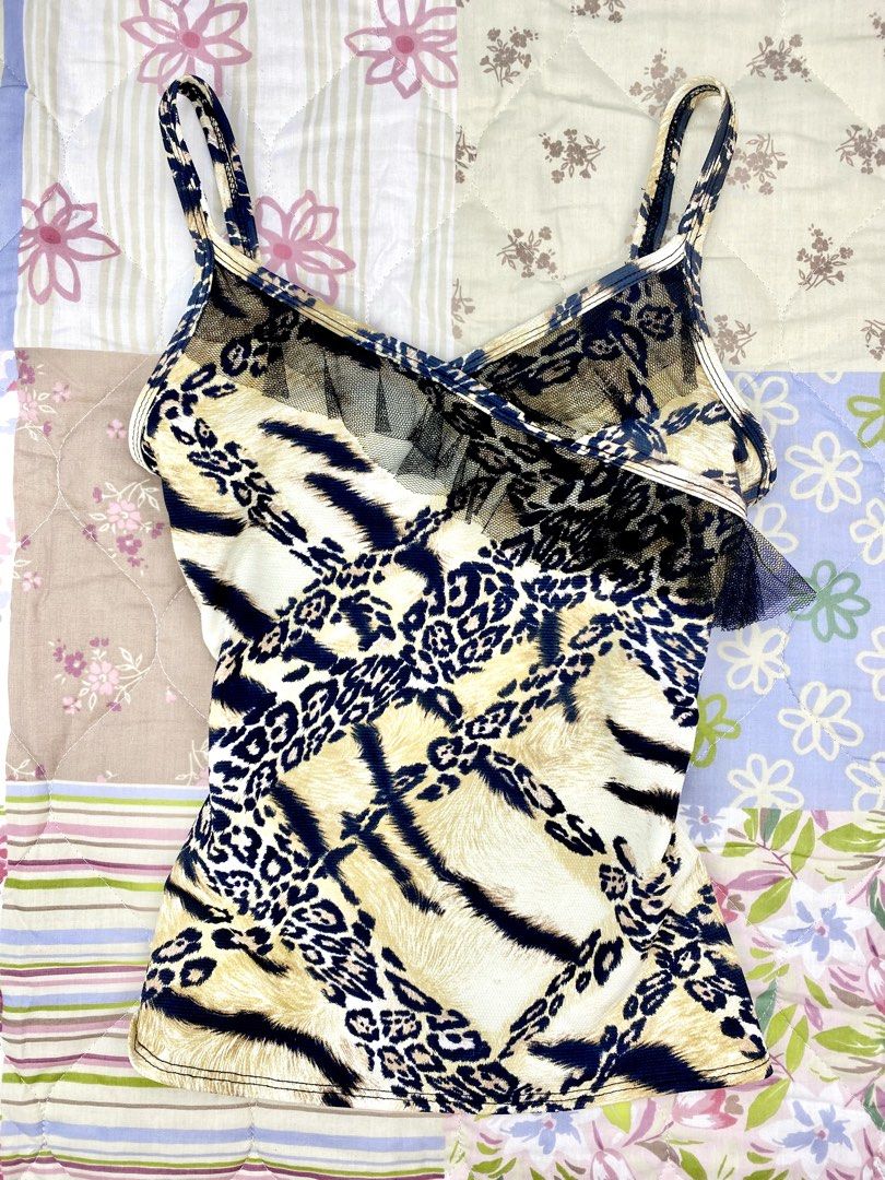 Bukkystop Animal Print Lace Cami Top (Category: Sleeveless) located in Angeles City. Submitted by fruits.ph (Listing ID 1465441164, Image 2). Description: Measurements B:13.5” W:13” L:19” (Fixed Straps) Size on Tag: ❌ Best Fit: S-M *Flat lay measurements* Mannequin Size: M (34”; 25”) Color Rate: 10/10 Flaws: None Fabric Type: Polyester Cotton/ Stretchable Fabric ***Color may vary due to lighting. This item is properly washed and disinfected.***.