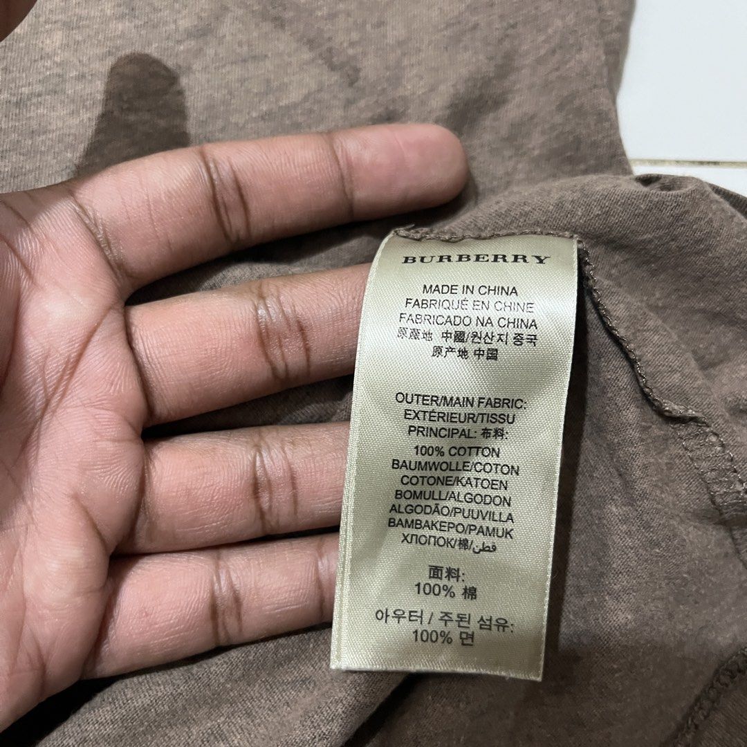 Burberry (Category: Tshirts & Polo Shirts ) located in Bacoor. Submitted by manonghits_2000 (Listing ID 1465542110, Image 3). Description: Burberry Measurement: 20.5x26.6 Color: Brown Color Rate: 9.5/10 Condition: Good as New Issue: None Claim 380 .