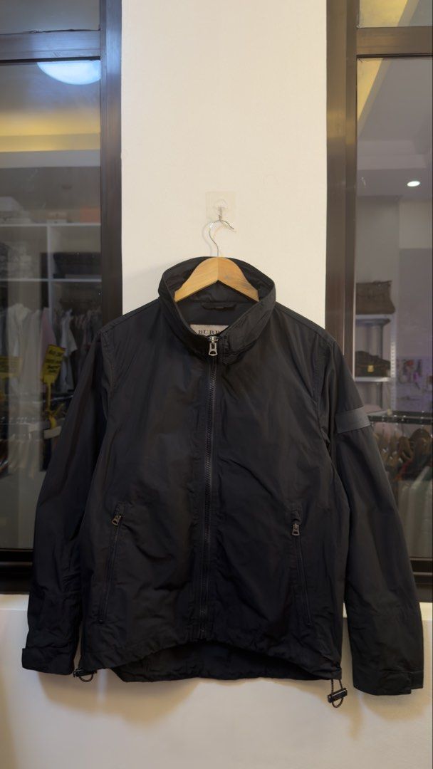 Burberry Black Nylon Zip Jacket (Category: Coats, Jackets and Outerwear) located in Paranaque City. Submitted by mykapoynton (Listing ID 1465548109, Image 2). Description: Burberry Black Nylon Zip Jacket - Color: Black - Material: 100% polyester - Closure: Full zip front with high collar - Pockets: Convenient side zippered pockets - Fit: Adjustable drawstrings at the hem - Origin: Made in Thailand - Condition: Like new (worn once for photos).