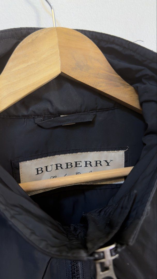 Burberry Black Nylon Zip Jacket (Category: Coats, Jackets and Outerwear) located in Paranaque City. Submitted by preluxeshop_ph (Listing ID 1465549912, Image 3). Description: Burberry Black Nylon Zip Jacket - Color: Black - Material: 100% polyester - Closure: Full zip front with high collar - Pockets: Convenient side zippered pockets - Fit: Adjustable drawstrings at the hem - Origin: Made in Thailand - Condition: Like new (worn once for photos) �