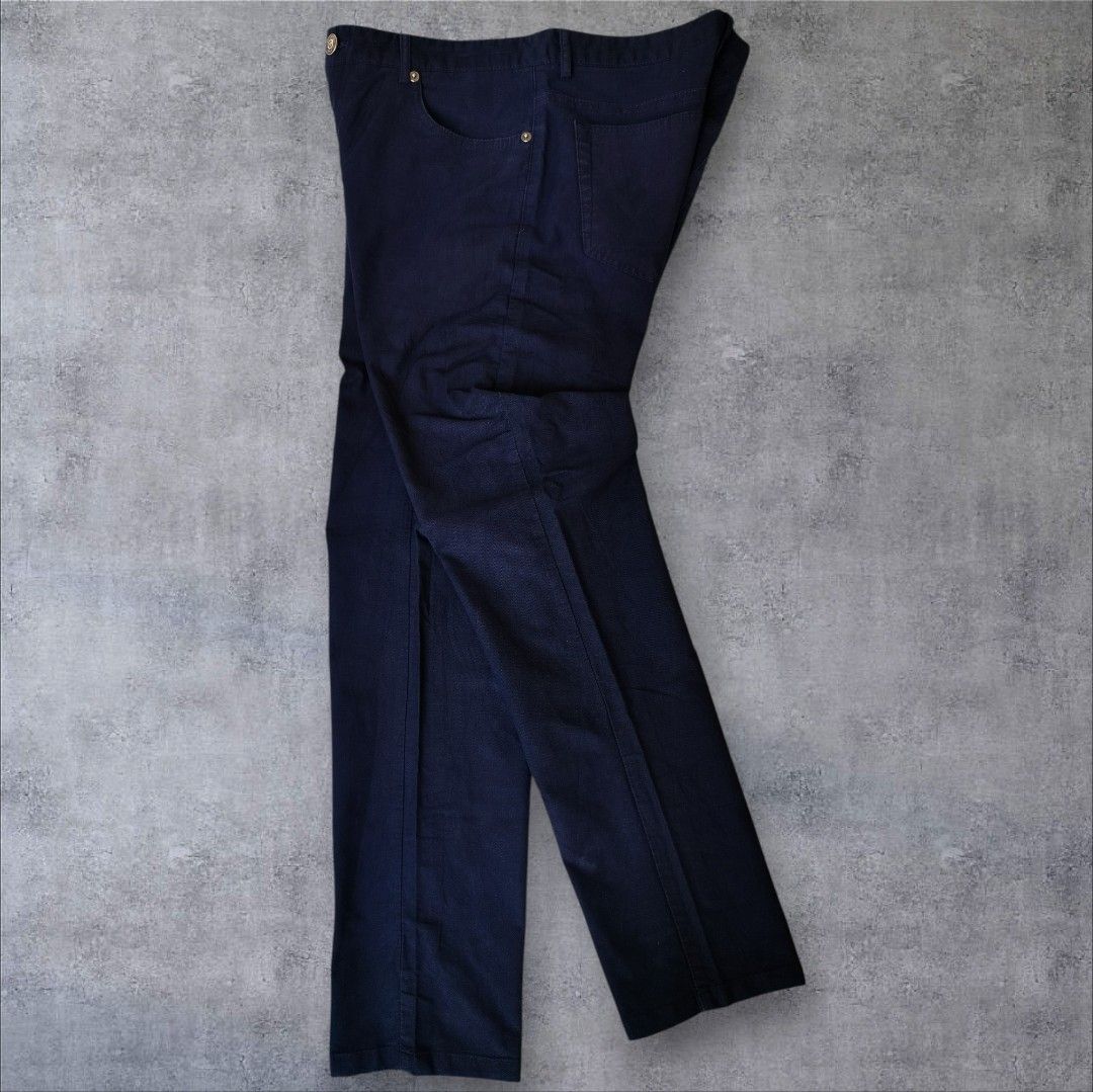Burberry Brit Dark Blue Trousers (Category: Trousers) located in Manila. Submitted by gerald_quinto (Listing ID 1465476048, Image 1). Description: - Brand: Burberry Brit -Size 34 -Length 40 -Hem 7 - Color: Dark blue twill - Fit: Straight leg - Closure: Button fly with branded metal hardware - Details: Red embroidered monogram on coin pocket, interior cotton blend fabric with cow grain leather trim - Origin: Made in China.