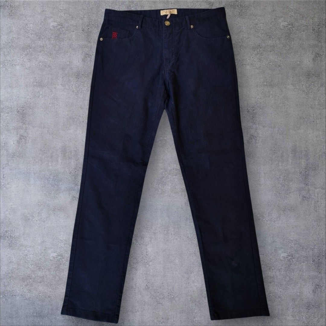 Burberry Brit Dark Blue Trousers (Category: Trousers) located in Manila. Submitted by gerald_quinto (Listing ID 1465476048, Image 2). Description: - Brand: Burberry Brit -Size 34 -Length 40 -Hem 7 - Color: Dark blue twill - Fit: Straight leg - Closure: Button fly with branded metal hardware - Details: Red embroidered monogram on coin pocket, interior cotton blend fabric with cow grain leather trim - Origin: Made in China.